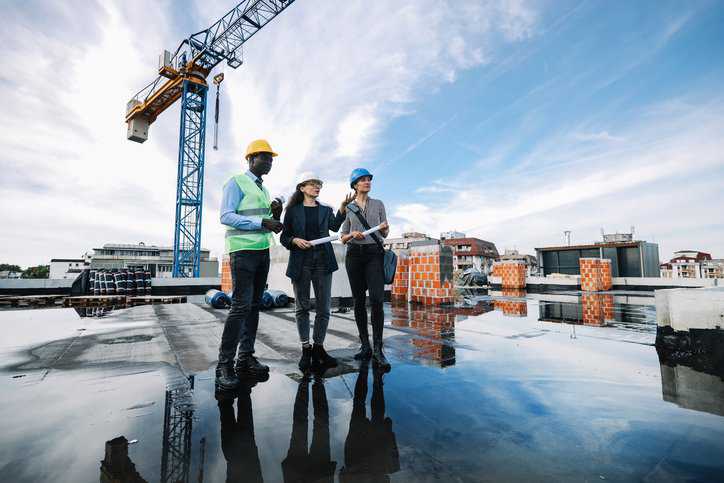 Architects and investors meeting at the construction site for Special Inspections to ensure compliance to the International building Code.