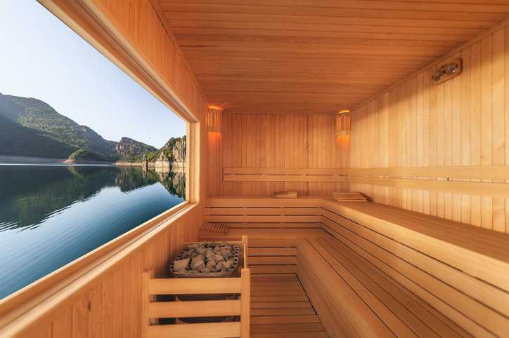 Sauna with a mountain and lake view that adheres to electrical safety requirements in IEC 60335-2-53 Ed. 4.1 b:2017.