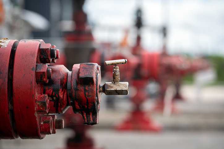 Old red needle valve in oil refinery, otherwise known as an MSS SP-99-2023 instrument valve.