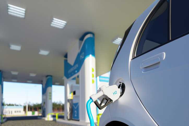 Refueling a CSA/ANSI HGV 2-2023 vehicle fuel container with compressed hydrogen gas.