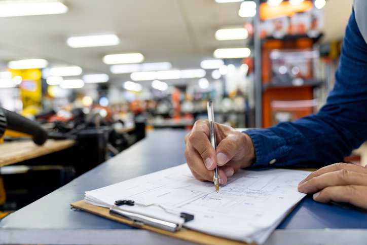 User following ISO/IEC 17000 conformity assessment for products in retail store.