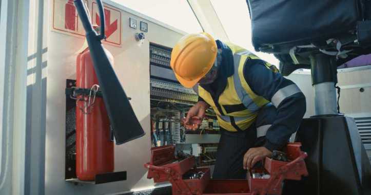 Electric technician adhering to NFPA 790-2024 and NFPA 791-2024 field evaluation requirements.