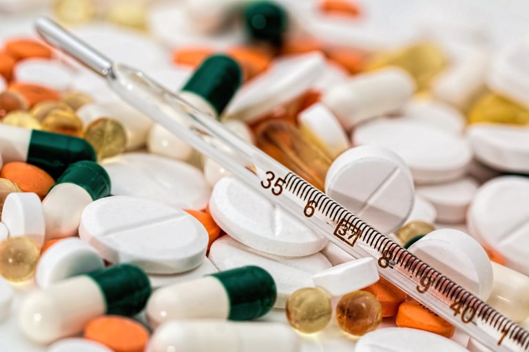 Medical drugs in a pharmacy adhering to ANSI/PDA Standard 001-2020 and FDA requirements.