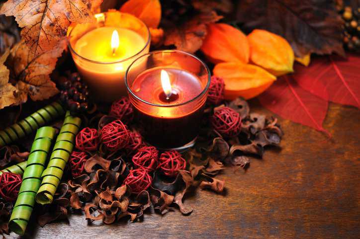 Burning candles with autumn decorations adhering to oxygen index in ASTM D2863-19.