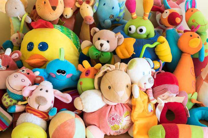 Toy Box full of soft toys in a child's bedroom that adhere to ISO 8124-2:2023 toy flammability testing.