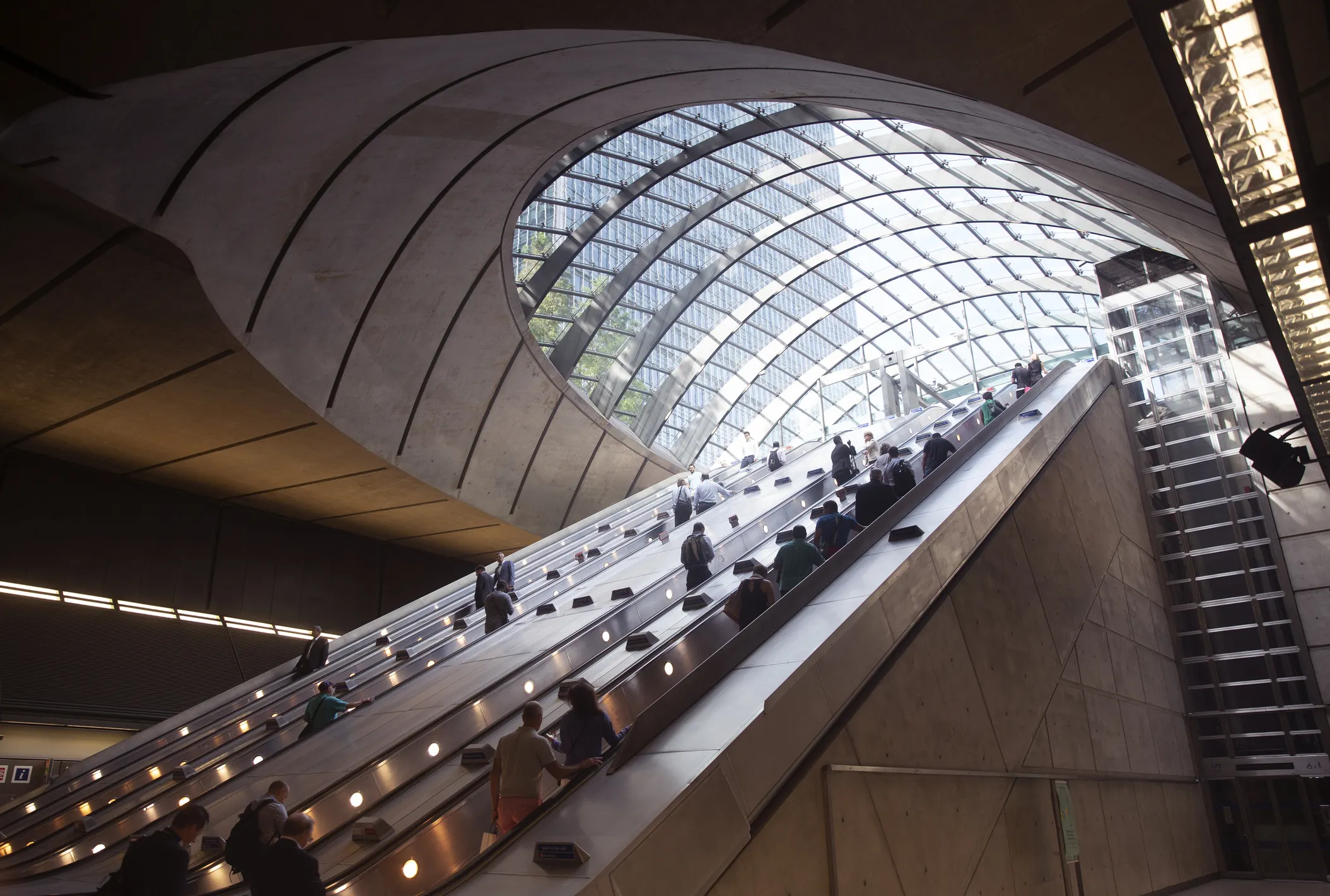 People moving up London Canary Wharf escalator
