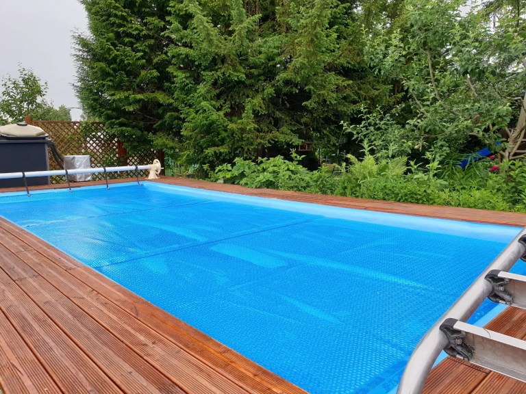Example of a swimming pool covering system, safely protect children and pets from accidental contact with water that adheres to ASTM F1346-91(2018).