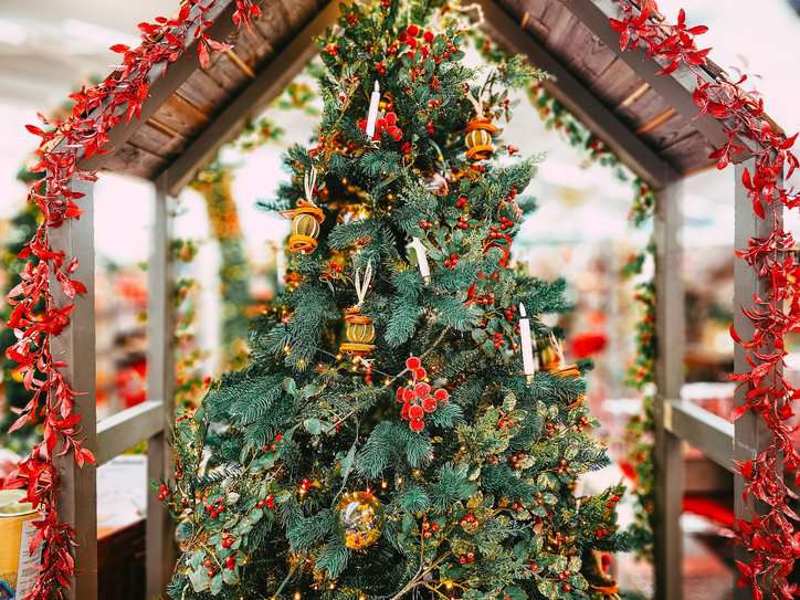 A Christmas tree in the store, decorated with an array of traditional ornaments including woodland creatures, candles and Christmas pudding that went through ASTM E3082-20 fir retardant treatment.