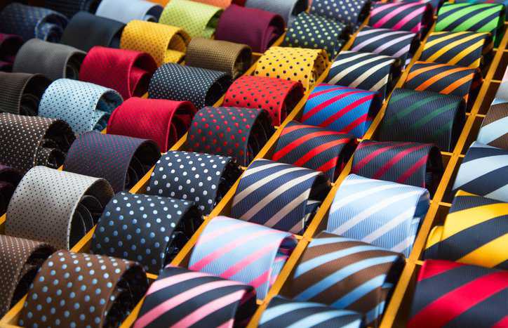 Colorful necktie collection in the men's shop with knitted fabrics adhering to ASTM D4035-22.