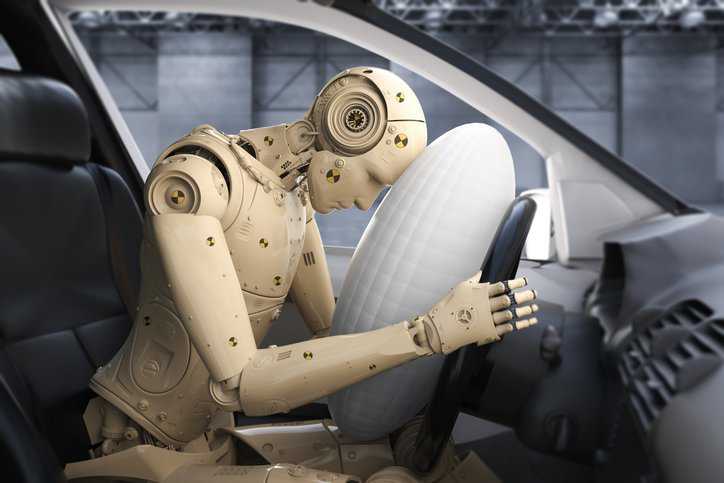 Dummy in a sled crash test, adhering to ISO 7862:2004, that evaluates road vehicular safety from head-on frontal collisions.