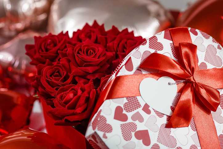 Valentine's Day holiday showcasing red roses and a box of chocolates.