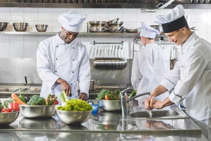 Food protection manager overseeing food safety and quality control at a restaurant.