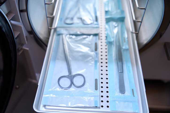 Medical instruments inserted into the autoclave for ethylene oxide (EO) sterilization process that adheres to AAMI TIR16:2023.