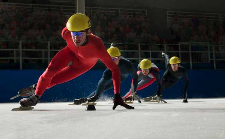 Group of speed skaters racing who are wearing helmets adhering to ASTM F1849-23.