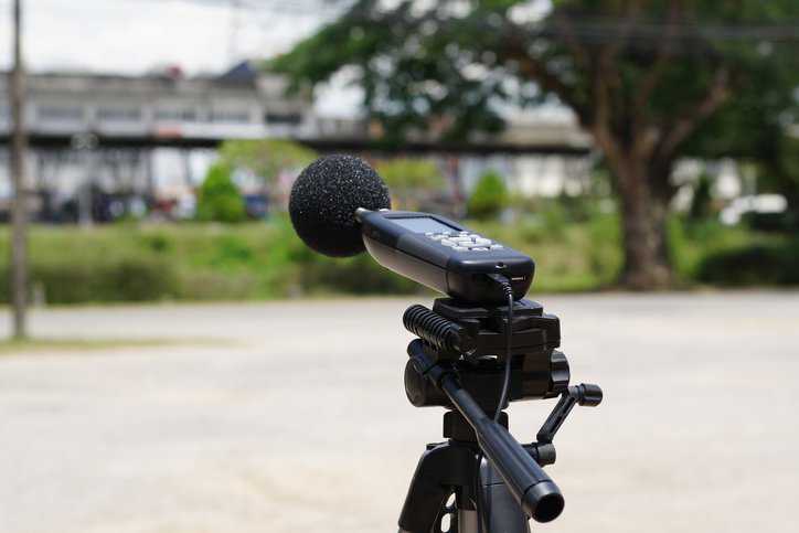 Measuring the noise on the road with a sound level meter that adheres to ASA/ANSI S12.18-1994 (R2023).