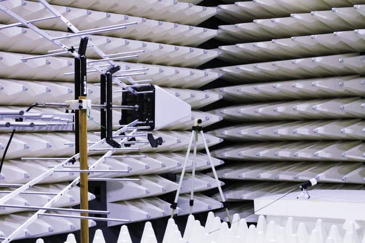 White antenna EMC technology being tested in a semi anechoic chamber.