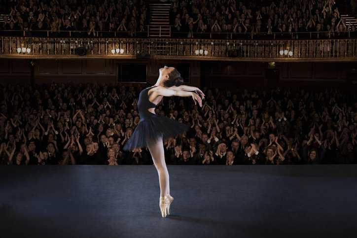 Ballerina performing in a theater with floors that adhere to ANSI E1.34.
