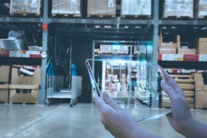 Manager using smart tablet to monitor warehouses operations, while celebration innovative technology and artificial intelligence for World Accreditation Day 2024.