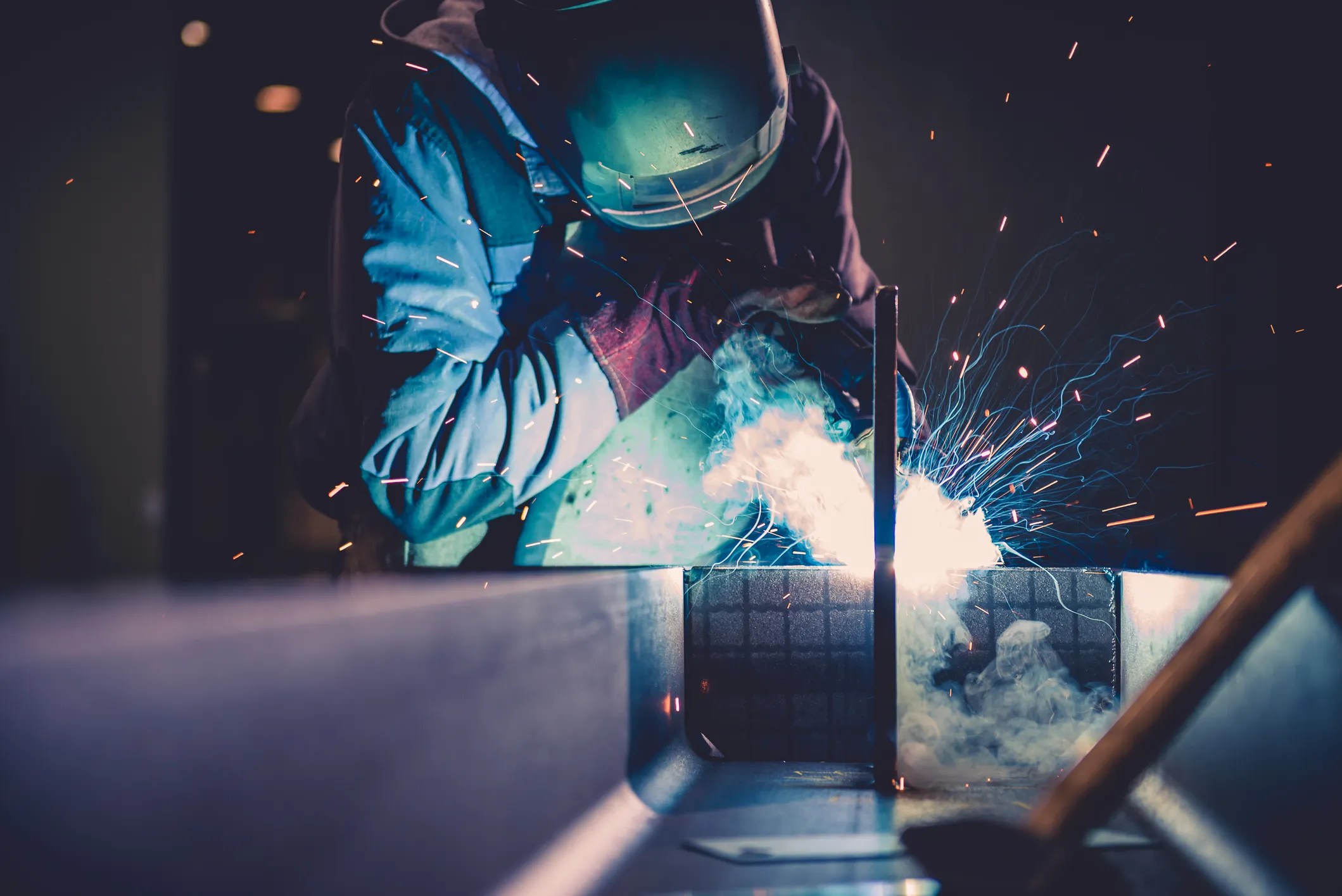 Welder preparing aerospace equipment through fusion welding specified to AWS D17.1:2024