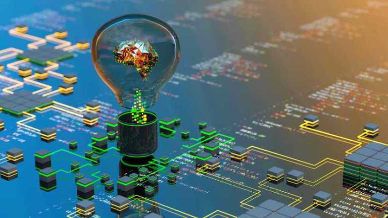 Brain in lightbulb concept on circuit board to represent AI.