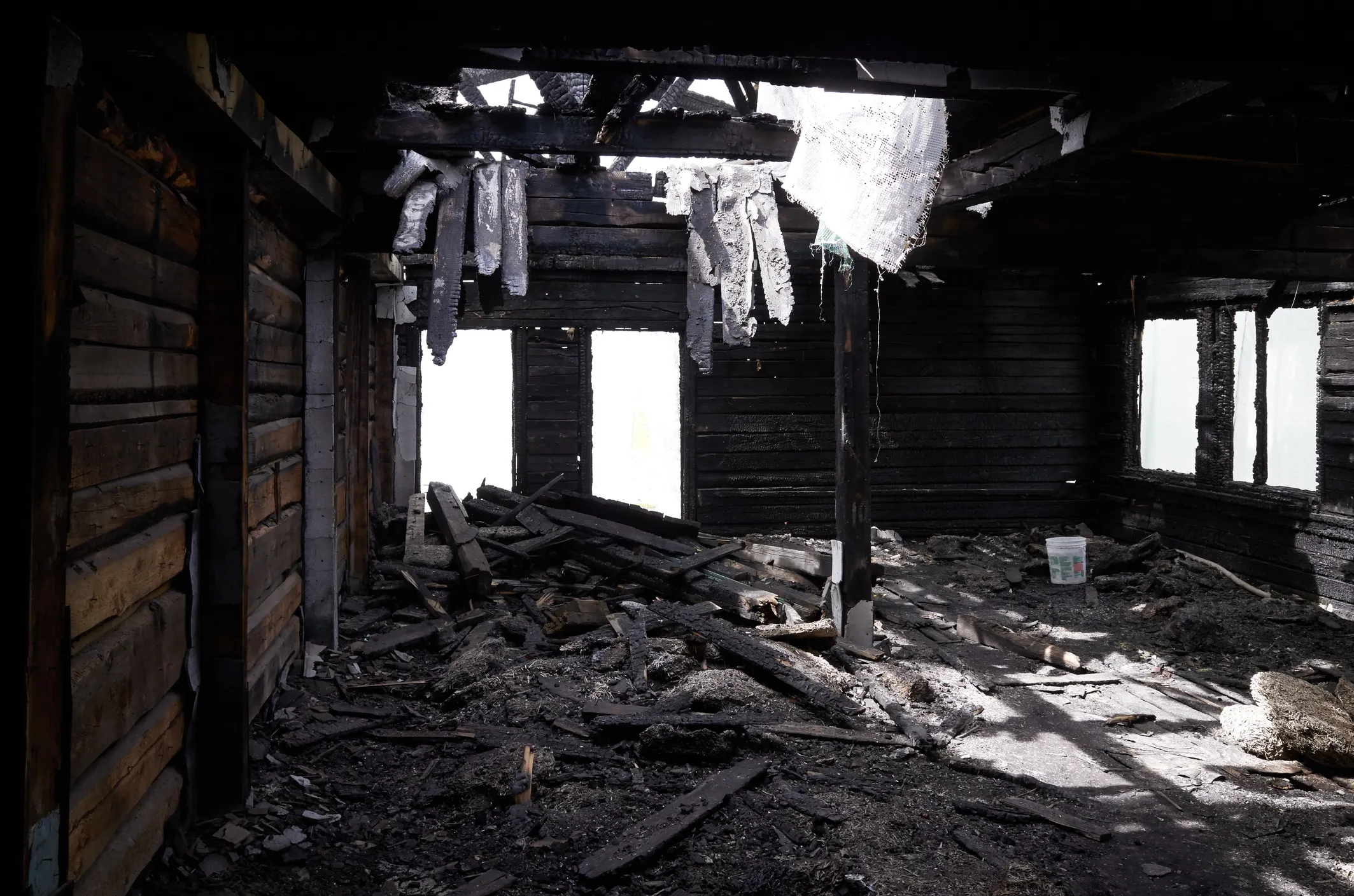 Charred inside of burned house that did not follow International Fire Code (IFC) design