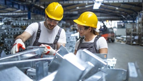 Factory employees using aluminum for the aerospace and automotive industry while using AA AAIA-2015 to assure quality aluminum characteristics.