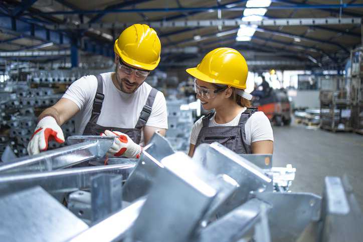 Factory employees using aluminum for the aerospace and automotive industry while using AA AAIA-2015 to assure quality aluminum characteristics.