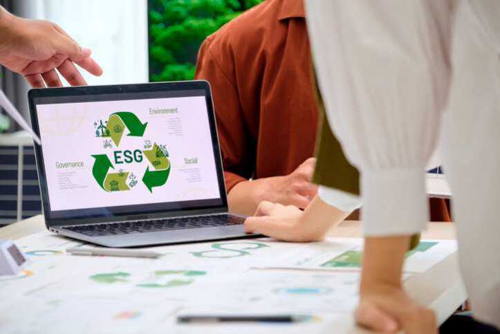 Corporate business people having a ESG meeting environment, society and governance, discussing sustainability in regards to adhering to IWA 48 ESG framework.