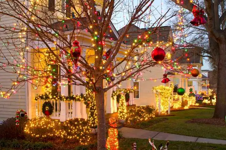 Traditional, Victorian-style homes in a Christmas town/village are beautifully decorated for the holiday season with holiday lighting that adheres to UL 588 Ed. 19-2015 requirements.