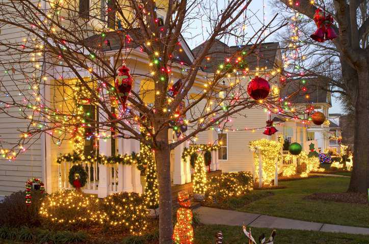Traditional, Victorian-style homes in a Christmas town/village are beautifully decorated for the holiday season with holiday lighting that adheres to UL 588 Ed. 19-2015 requirements.