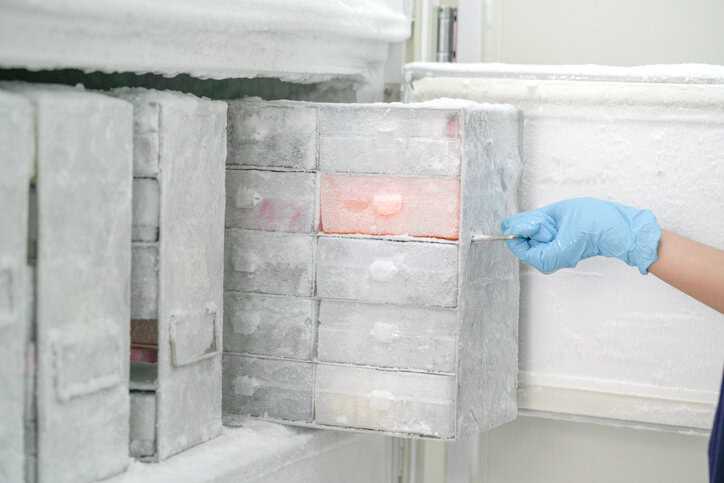 Frozen case of samples being pulled from ultra-low temperature freezer.
