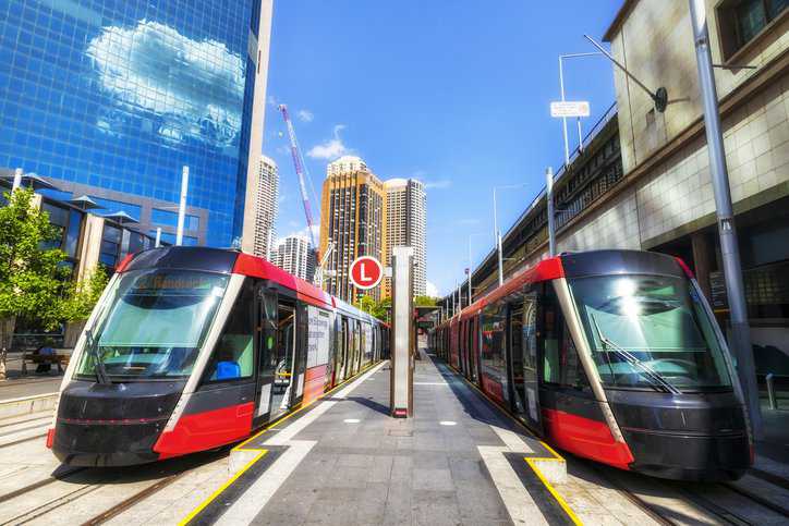 Light rail vehicles in a city that adhere to ASME RT-1-2020