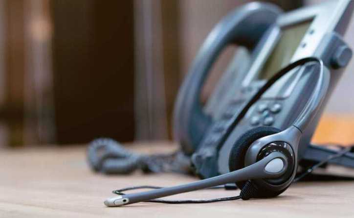 Customer service represented through work phone and headset.