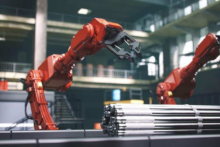 Industrial robots at the automated manufacturing factory assembly line, adhering to ISO 10218-2:2025.