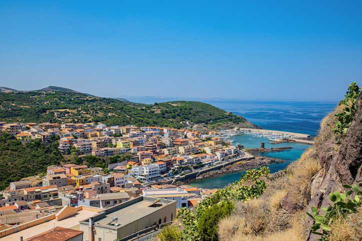 Aerial view of the town and beaches of Sardinia, Italy: a Blue Zone.