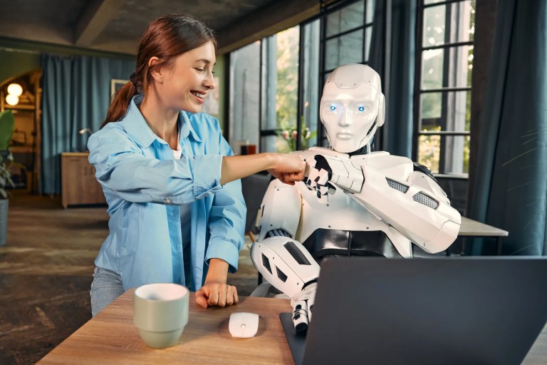 AI robot collaborating with human worker in a modern office, representing the integration of artificial intelligence in the workplace.