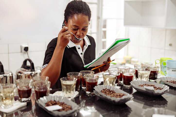 Industry professional conducting a sensory analysis evaluation of coffee that adheres to ISO 18794:2018 guidelines