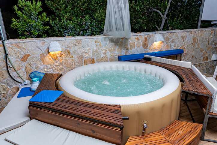 A portable electrical spa, adhering to NSF P181-4, in an individual's home.