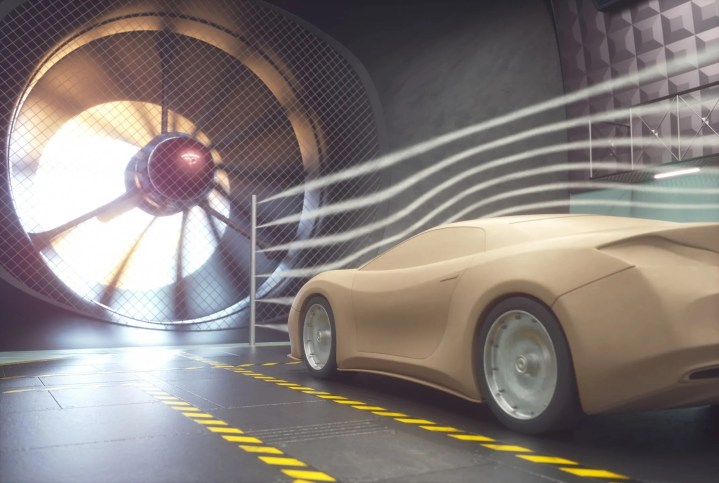 Researchers in a calibration lab testing the aerodynamics of a car to assure compliance with AIAA G-160-2025 wind tunnel testing criteria.