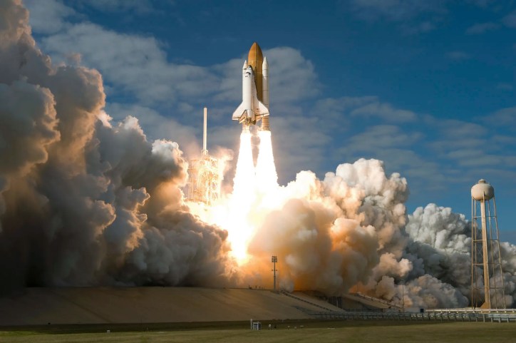 Spacecraft launching into space, adhering to AIAA R-099-2001 space launch system guidelines.