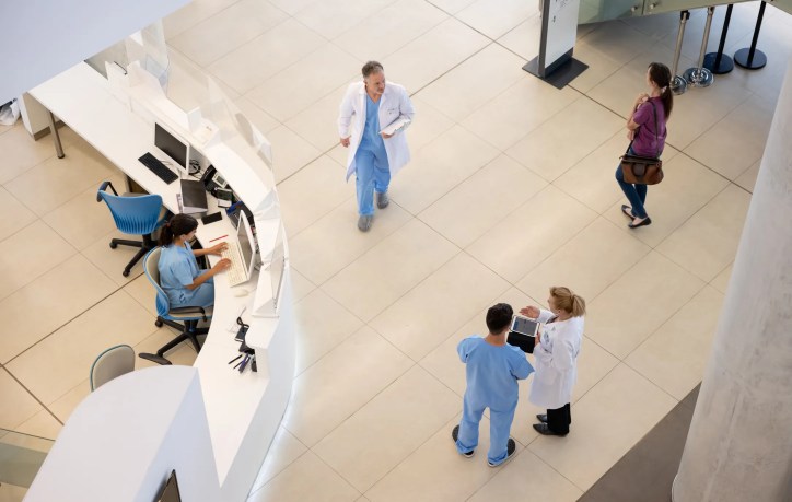Certified doctors walking through hospital lobby