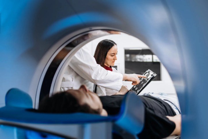 Patient in a MRI machine that adheres to ASTM standards for MRI safety.