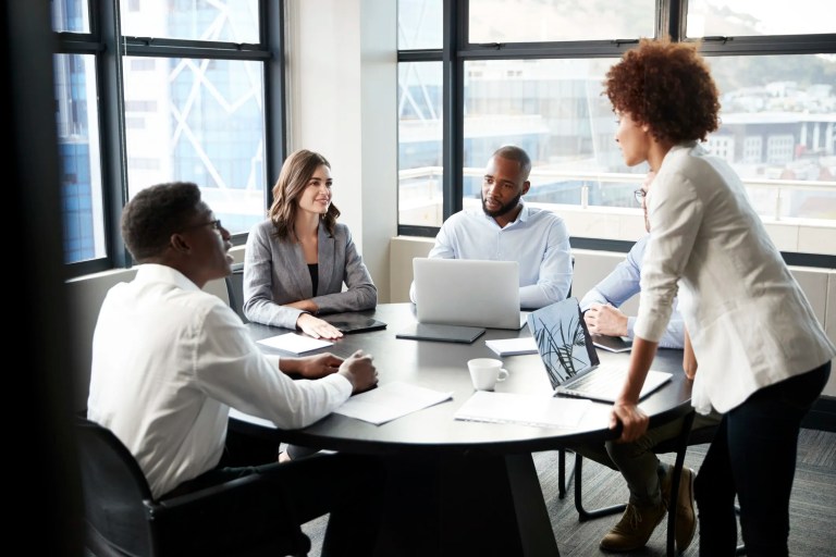 Business professionals having a meeting to develop standards.