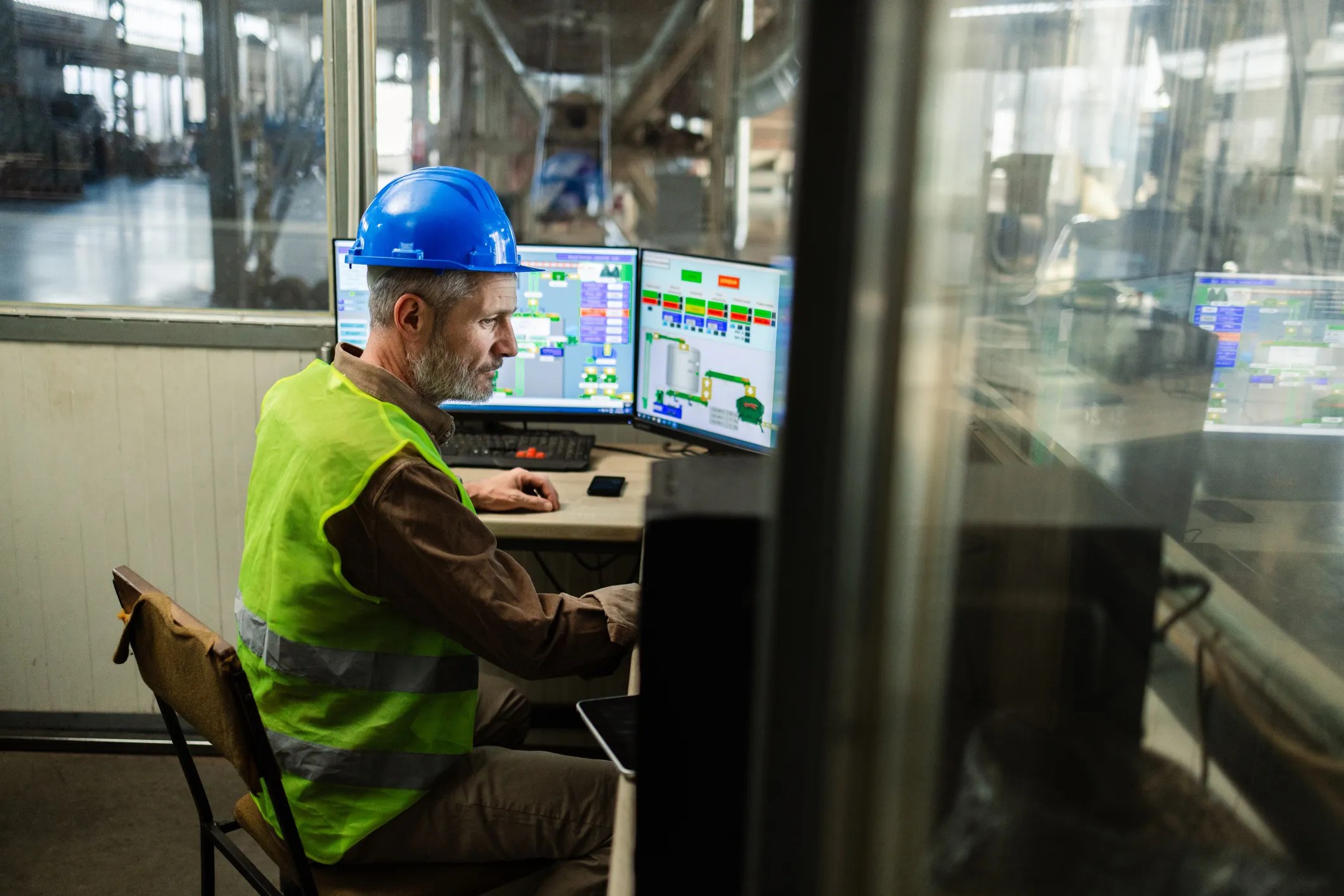 Employee conducting quality management system (QMS) in warehouse that is ISO 9001-compliant.