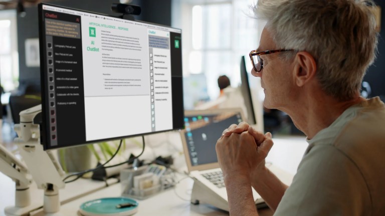 Woman interacting with an AI chatbot interface on a laptop, exploring AI-driven tools for enhancing critical thinking and learning.