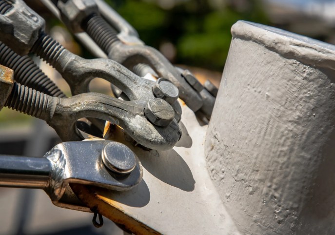 Various types of rigging hardware as defined by ASME B30.26, including shackles, eyebolts, and turnbuckles.