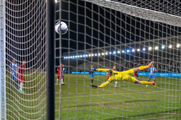 Professional soccer game, showcasing the important of safety standards for soccer equipment like soccer goals and cleats.