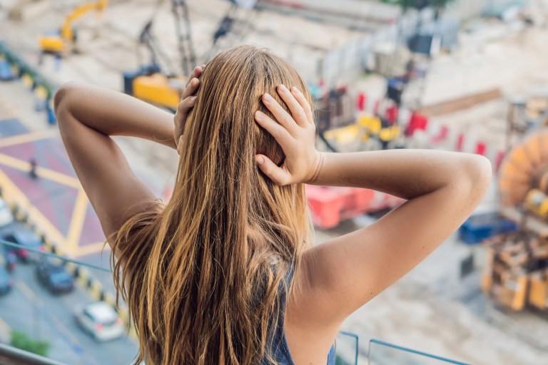 Illustration of sound waves traveling through the atmosphere, showing how sound absorption occurs due to environmental factors like temperature, humidity, and pressure. The image represents the principles of sound attenuation as described in ASA/ANSI ASA S1.26-2014 (R2024).