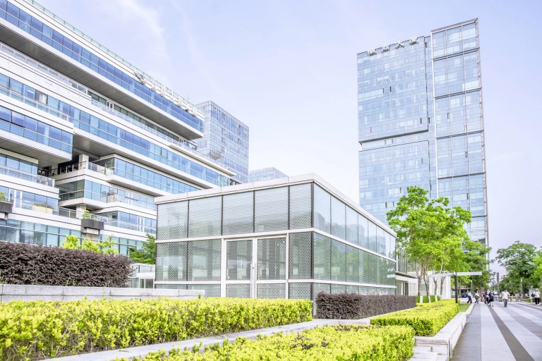 Smart building design strategies and energy-efficient certifications like Energy Star and LEED as well as standards like ISO 50001:2018 help reduce energy consumption, minimize environmental impact, and enhance occupant comfort in commercial and residential buildings.