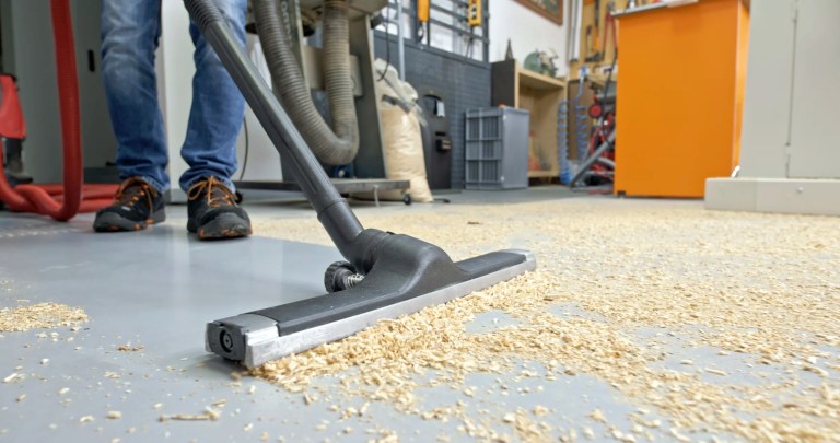 Vacuum picking up combustible dust on factory floor